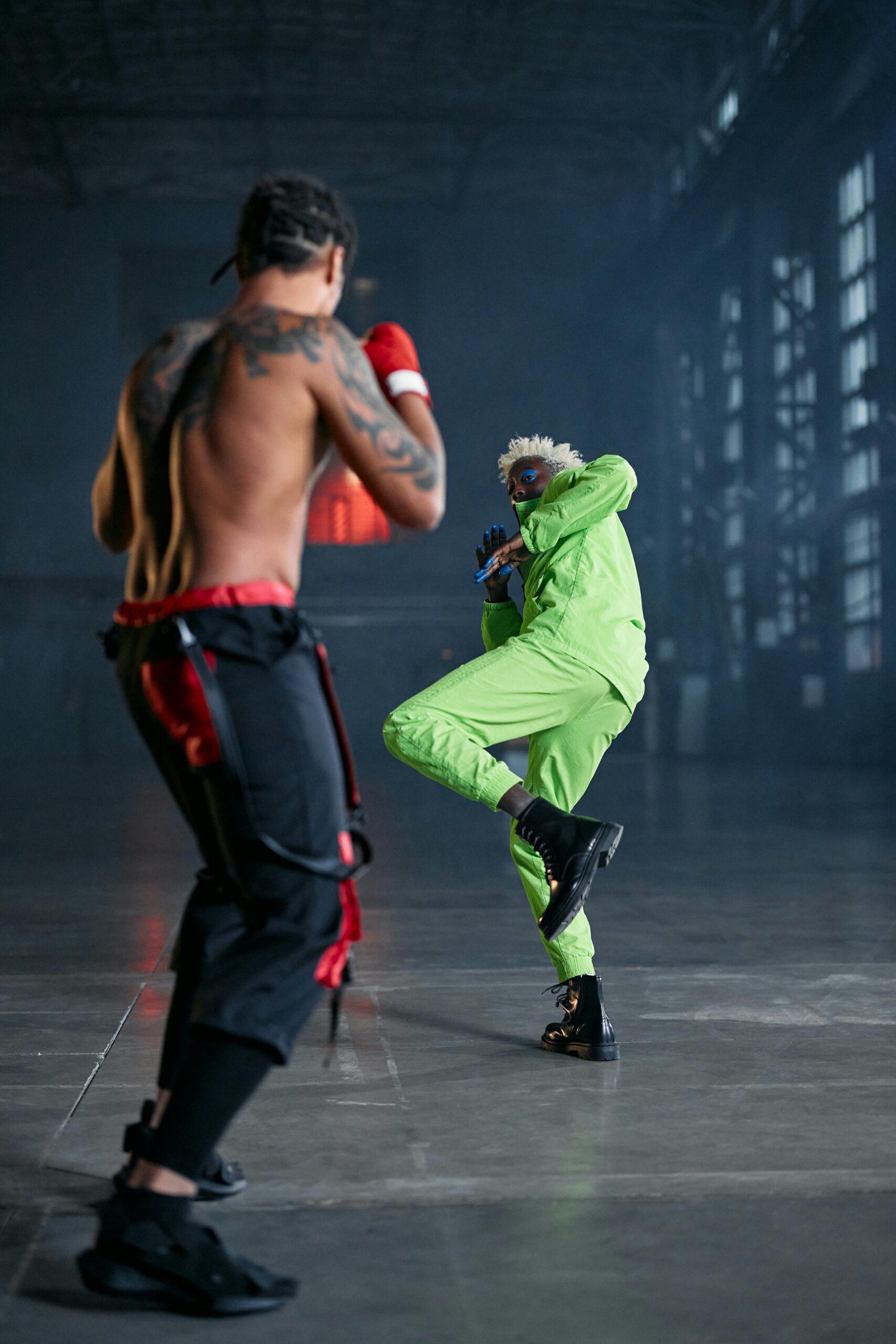 Intense cosplay fight scene resembling a video game battle with two men in dramatic poses.